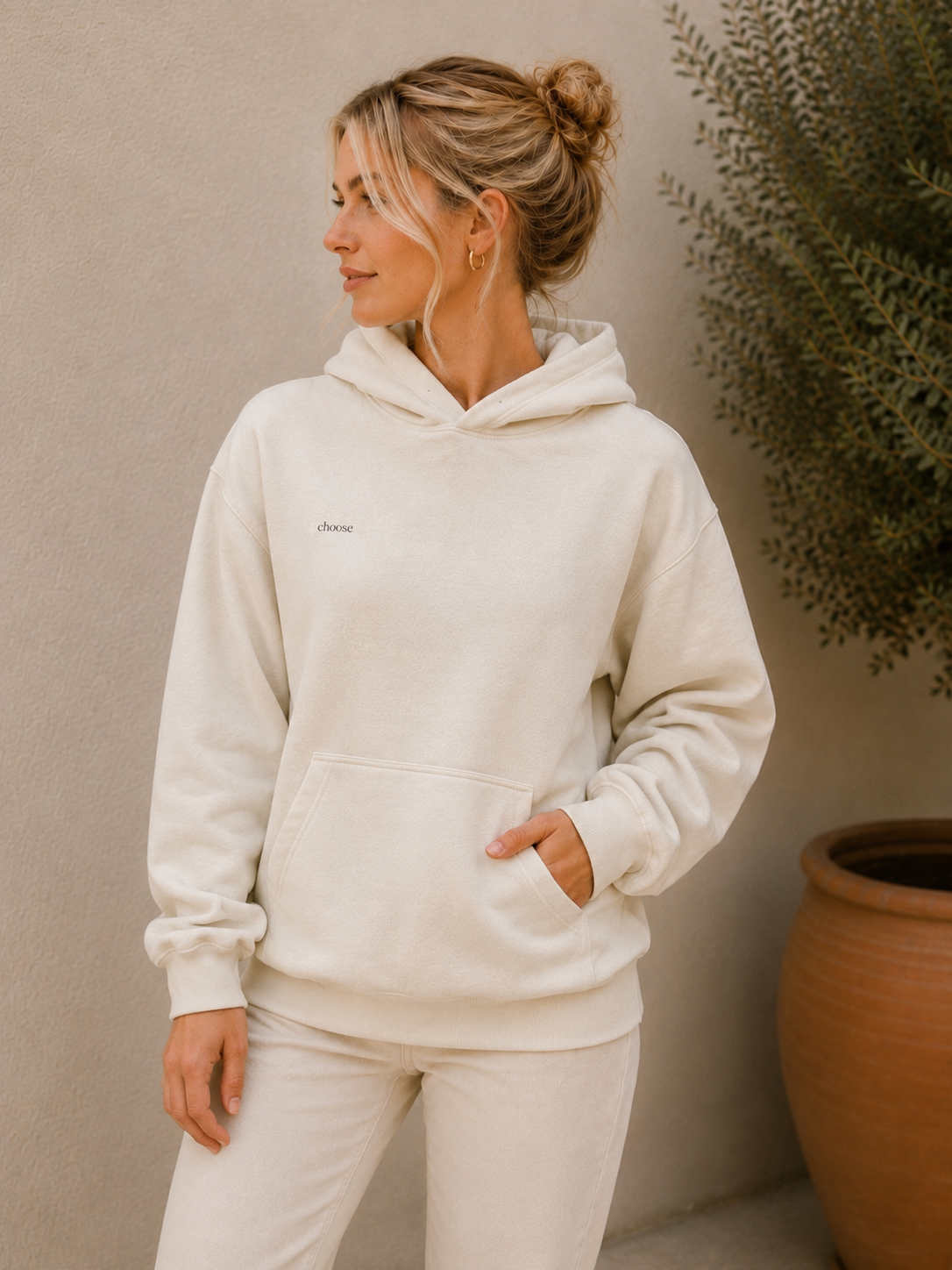 blonde model wearing white hoodie